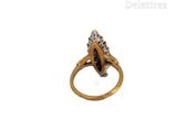 an image of a gold ring with diamonds on it