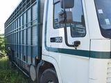 a large truck that is parked in the grass
