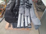 a lot of umbrellas that are sitting on a pallet