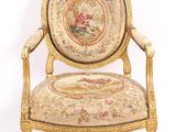 an image of a chair with a tapestry on the back of it
