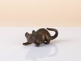 a small statue of a cat sitting on a table