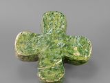 an image of a green cross shaped object on a gray surface