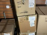 many boxes stacked on top of each other in a room