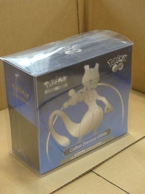 a box with a pokemon figure in it on the floor