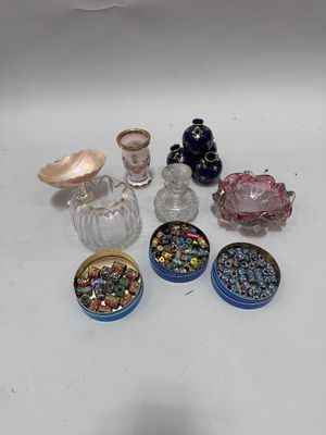 a lot of small glass objects sitting on a table
