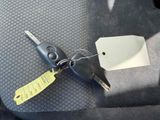 a car key with a tag attached to it