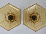 pair of gold plated wall sconces with a flower design