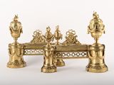 three golden vases sitting on top of a table