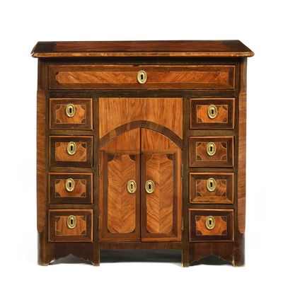 an image of a wooden cabinet with drawers and a door