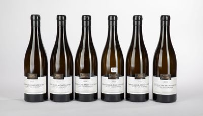 six bottles of wine are lined up in a row