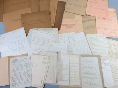 a pile of old papers sitting on a table