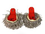 pair of red and white mop heads on a white surface