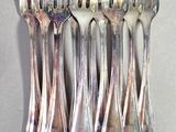 a lot of spoons that are sitting on a table
