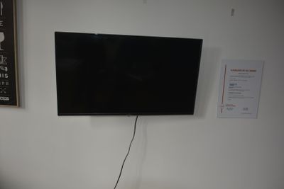 a flat screen tv mounted on the wall in a room