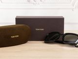 tom ford sunglasses with box and case on a wooden table