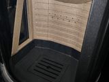 a black trash can with a black lid and a black trash can