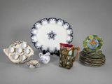 many plates and cups that are sitting on a table