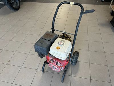 a small lawn mower sitting on the floor in a store