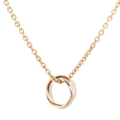 a gold necklace with two inter links on a chain