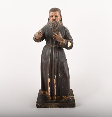 an old statue of a man with a beard and a long beard