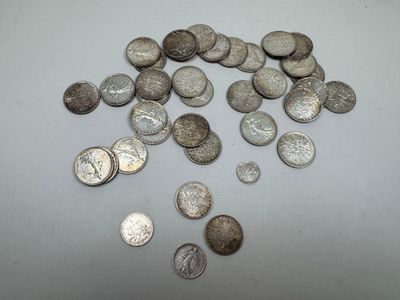 a pile of silver coins sitting on a table