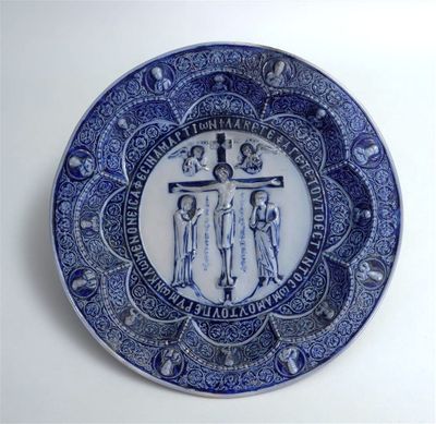 an image of a blue and white plate with a cross on it