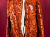 an orange leather jacket on a mannequin mannequin mannequin mannequin mannequin mannequin mannequin mannequin manne