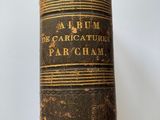a close up of a book on a table with a white background