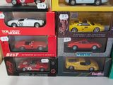 several toy cars are stacked on top of each other on a table