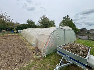 a trailer with a trailer attached to it in a field