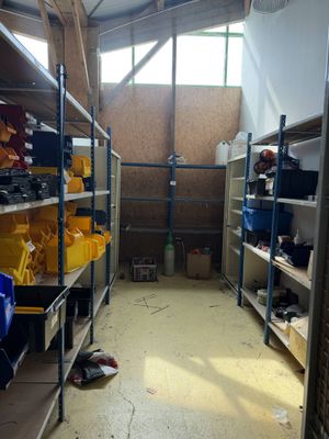 a room filled with lots of shelves and bins