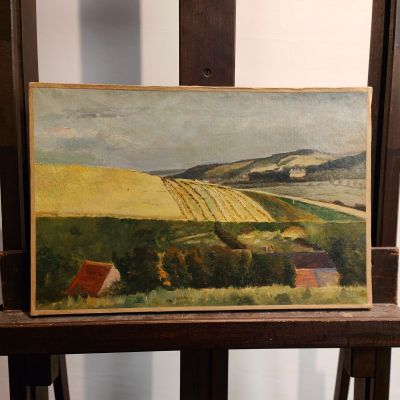 a picture of a painting on a easel in a room