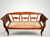 a wooden bench with a seat made out of wood