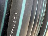 a close up of a bunch of black hoses on the ground