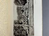 an open book with a black and white photo of a train on the tracks