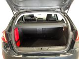 the back of a car with its trunk open and the back seats folded down