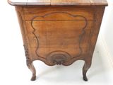 a small wooden cabinet with a drawer on it