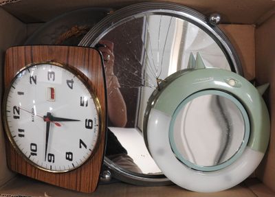 a box with a clock and a teapot inside of it
