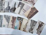 a lot of old postcards that are on a table