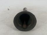 a small metal object that is sitting on the ground