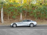 a silver sports car parked on the side of the road