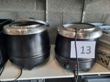 two pots that are sitting on a shelf next to each other