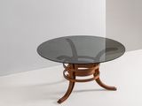 une photo d'une table en verre avec un piètement et des pieds en bois
