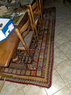 an image of a dining room with a table and chairs