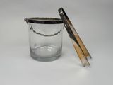 a glass jar with a wooden lid on a white surface