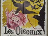 an old movie poster for les oiseaux, starring the birds and the woman