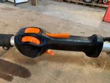 a black and orange corded blower sitting on a table