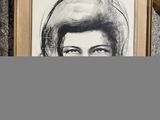 a picture of a woman that is on the wall