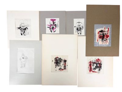 several different types of art work are displayed on a white surface