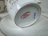 a cup and saucer sitting on a saucer on a table